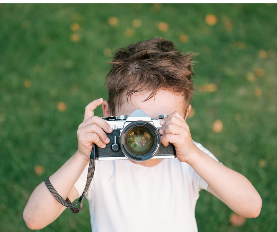  Child holding camera.